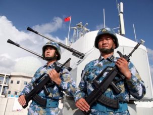 Chinese People's Liberation Army Navy officers stand on guard